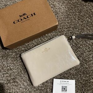 Coach Beige Wristlet Patent gold accents